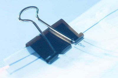 bulldog clip on piece of paper